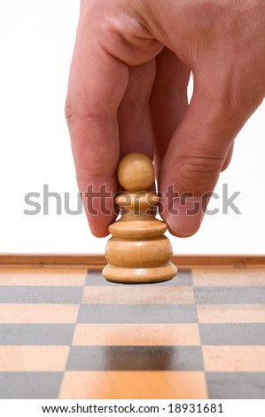 Hand moving chess figure,white background