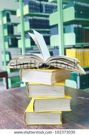 Yellow books stack in library