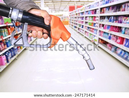 oil pump nozzle and supermarket background