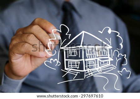 businessman hand hold house drawing