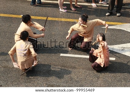 CHIANG MAI, THAILAND - APRIL 13: Unidentified people sword dance celebration of Thai New Year (Songkran water festival) on April 13, 2012 in Chiang Mai, Thailand.