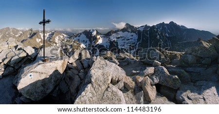Cross and the snowy mountains. Tatra Mountains.