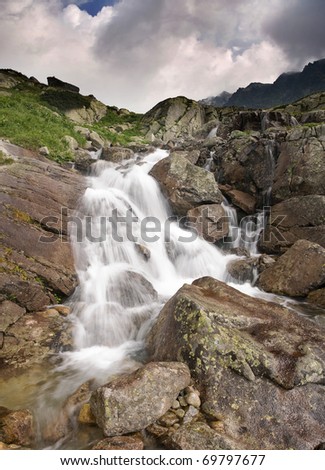 View of a mountains waterfall. Slovakian High Tatra Mountains.