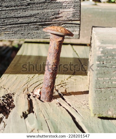 rusty nail in old wood