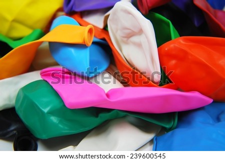 Colorful deflated balloons isolated on white background