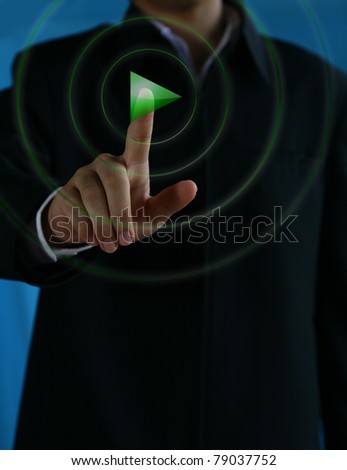 A man touching button play