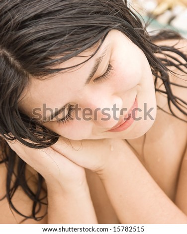 Beautiful young woman dreaming in the bathroom.