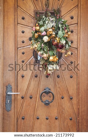 Door decoration with dry roses.