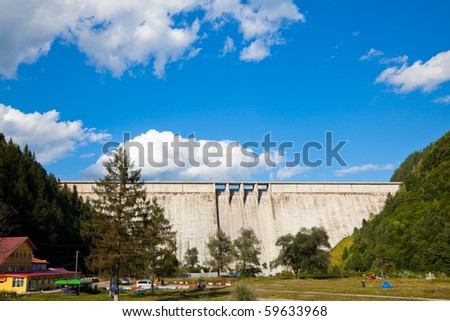 BICAZ, ROMANIA - AUGUST 21: The Bicaz Dam on August 21, 2010 in Bicaz, Romania. Built in the 1950s is used to generate hydroelectricity at the hydro-plant. It is 127 meters tall and 435 meters long.