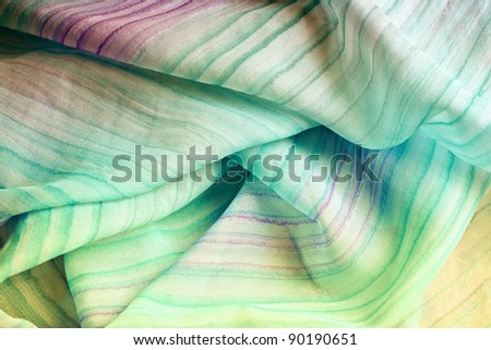 Close up of a colorful silk scarf.