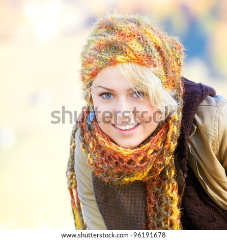 Portrait of a happy young blonde outdoor in the countryside.