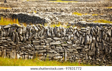 Rows of stone traditional irish fences on Inisheer Island, Ireland.