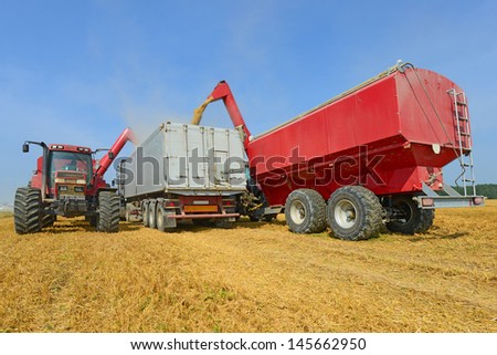 Overloading of grain bins in a car tractor.