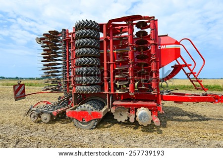 Kalush, Ukraine â?? August 10: Tractor-drawn seeding machine in position for transport in the field near the town Kalush, Western Ukraine August 10, 2014