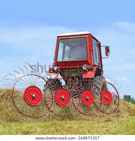 Kalush, Ukraine - June 25: Hay harvesting in the field near the town Kalush, Western Ukraine June 25, 2014