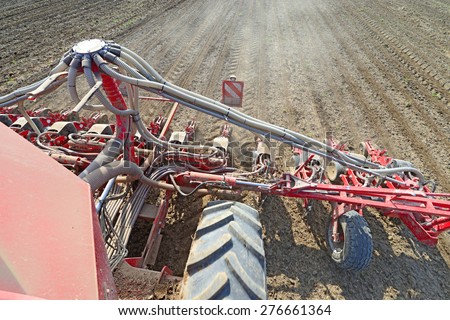 Kalush, Ukraine - May 10: Modern tractor-drawn seeding machine in the field near the town Kalush, Western Ukraine May 10, 2015