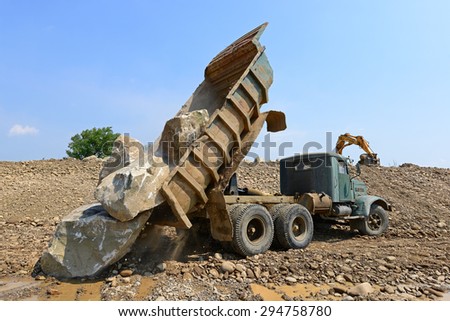 Kalush, Ukraine - July 8: Lorry on the construction of a protective dam near the town of Kalush, Western Ukraine July 8, 2015