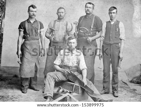 Us - Kansas - Circa 1885 - A Vintage Photo Of A Group Of Five Blacksmith\'S. They Are Holding The Tools Used By A Blacksmith. Circa 1885