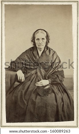 US - Ohio - CIRCA 1860 A vintage Cartes de visite photo of an elderly pioneer woman in mourning. She is dressed in a black mourning gown.  A photo from the Civil War era. CIRCA 1860