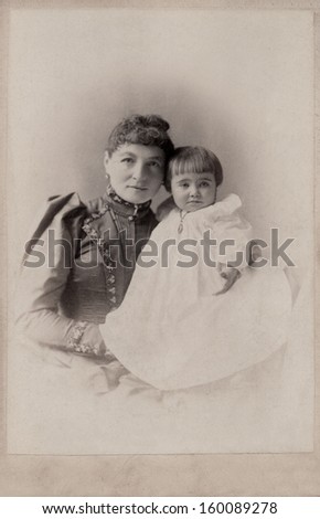 US - New York - CIRCA 1890 - A vintage photo of a young mother with her daughter. A photo from the Victorian era. CIRCA 1890