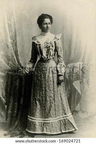 USA - WASHINGTON DC - CIRCA 1890 - A vintage antique photo of a young woman standing. The woman is dressed in a Victorian style dress. A photo from the Victorian era. CIRCA 1890