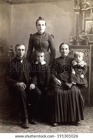 USA - WISCONSIN - CIRCA 1885 A vintage photo of a Victorian family. The parents are sitting with three children. The father has a beard. This photo is from the Victorian era. CIRCA 1885