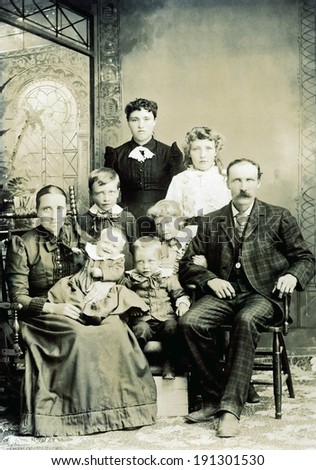 USA - WISCONSIN - CIRCA 1890 A vintage photo of a large Victorian family. The parents are sitting with six children. The mother is holding a smiling baby. Photo is from the Victorian era. CIRCA 1890