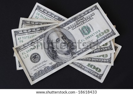 stock-photo-four-one-hundred-dollar-bills-isolated-on-black-background-18618433.jpg
