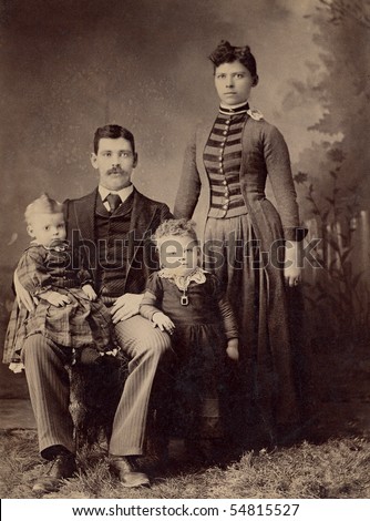 1800s Antique family portrait depicting a mother and father and their two children.