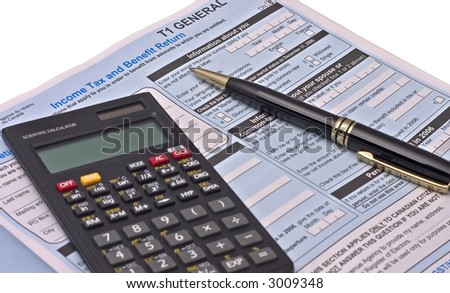 Canadian tax forms with calculator and pen isolated on white
