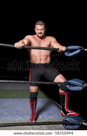 professional wrestler in a ring isolated on black