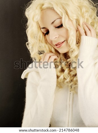 Pretty young woman with curly permed blond hair