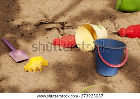 Plastic toys in sand box
