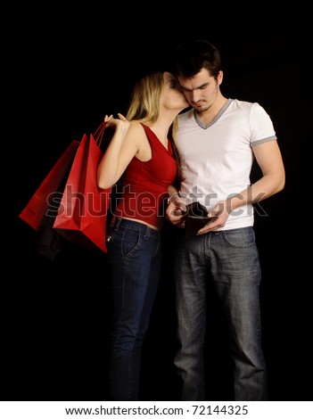Girl kissing her boyfriend for buying her presents, boyfriend is showing his empty wallet