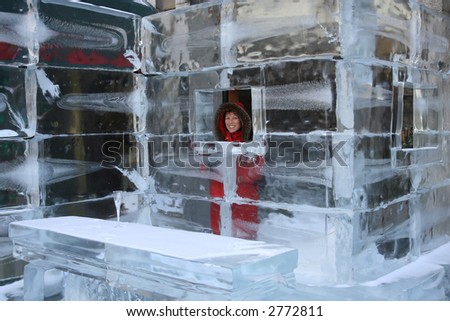 Pretty woman at the bar of an hotel made of ice