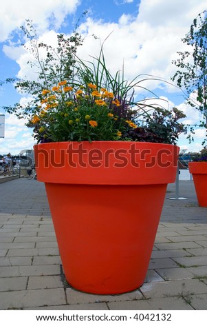 Bunch of assorted flowers in a huge pot