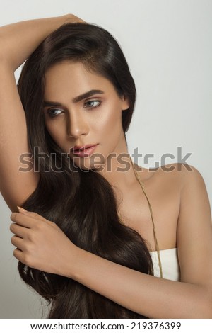 portrait of a beautiful Indian girl with amazing long hair.