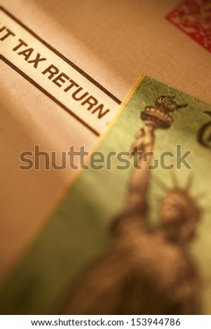 Income tax return check on tax return document.