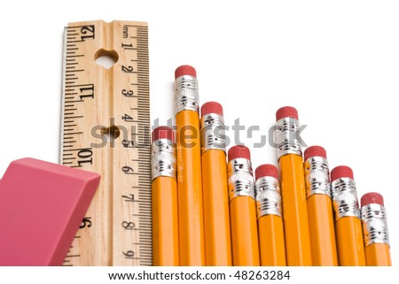 Close up of eraser,ruler and pencils against white background.