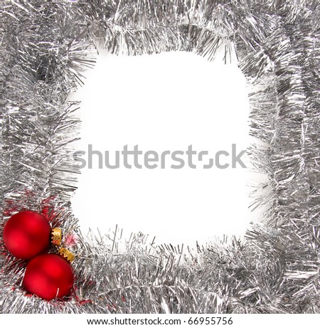 A frame created by silver garland decorated with red Christmas baubles. Ready to drop your holiday greetings.