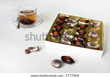 Chocolate-box with the cup of tea