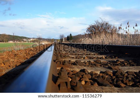 Closeup of straight railway tracks from low angle