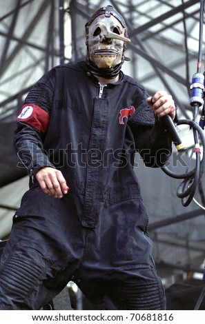 DENVER - JUNE 22: Percussionist Chris Fehn (#3) of the Heavy Metal band Slipknot performs live in concert June 22, 2001 at Mile High Stadium in Denver, CO.