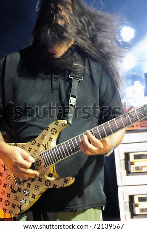 DENVER - OCTOBER 4: 		Guitarist Stephen Carpenter of the alternative heavy metal band Def Tones performs live in concert October 4, 2010 at Red Rocks Amphitheater in Denver, CO.