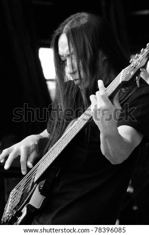 DENVER	JUNE 14:	Bassist John Myung of the Progressive Metal band Dream Theater performs in concert June 14, 2010 at the Comfort Dental Amphitheater in Denver, CO.
