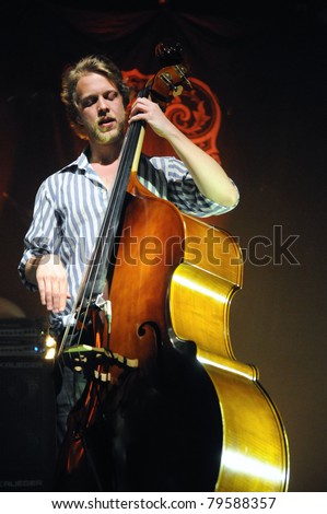 DENVER	JUNE 15:	String Bass/Drummer/Guitarist Ted Dwane of the Folk Rock band Mumford & Sons performs in concert June 15, 2011 at the Fillmore Auditorium in Denver, CO.
