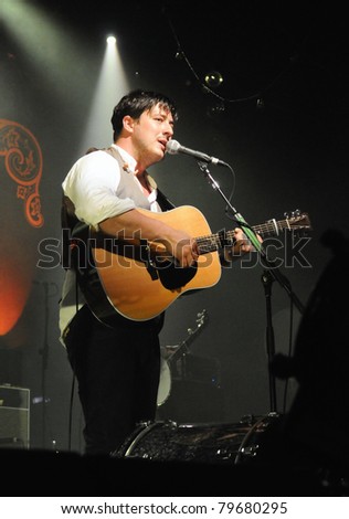 DENVER-JUNE 15:	Vocalist/Guitarist/Percussionist Marcus Mumford of the Folk Rock band Mumford & Sons performs in concert June 15, 2011 at the Fillmore Auditorium in Denver, CO.