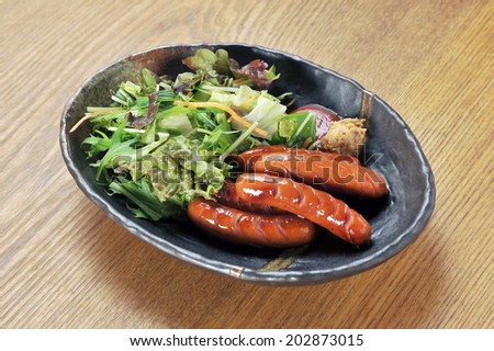 Japanese cuisine .Sausage making roasted with vegetable