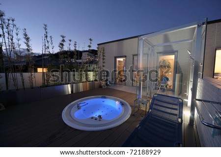 relaxation in luxury bubble bath at night on blue