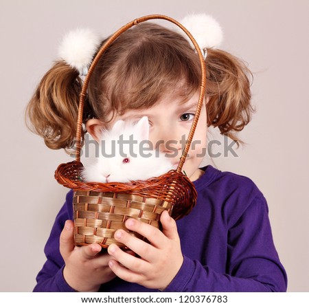little girl with white rabbit pet
